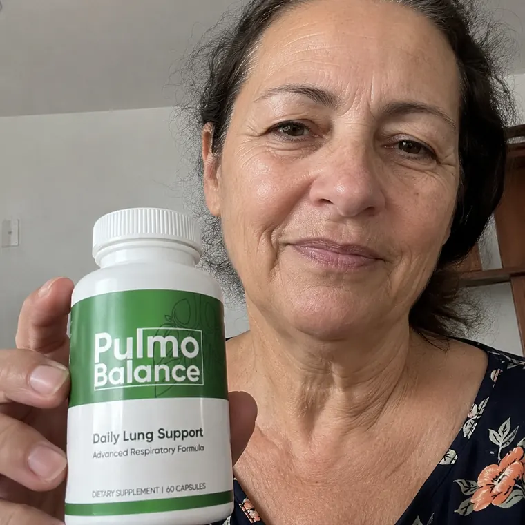 Person supporting lung health with Pulmo Balance